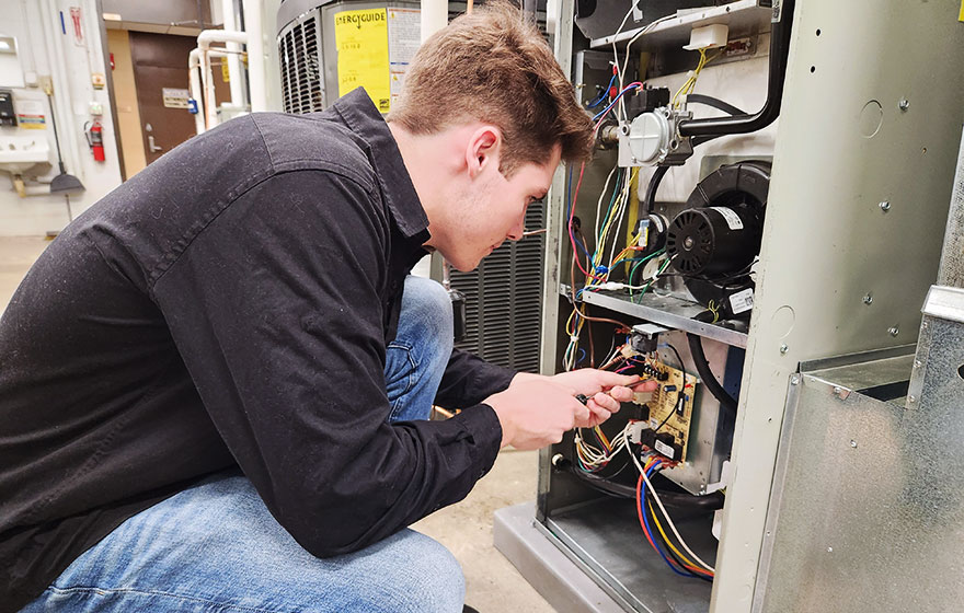 HVAC student working in Northwood Tech's state-of-the-art lab