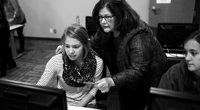 A business student receiving support from an instructor