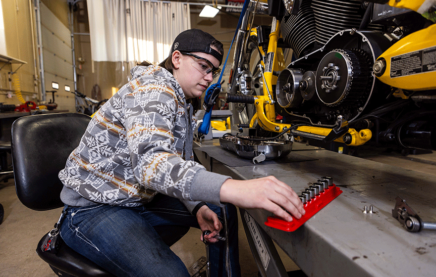 Power Sports Student working on motorcycle