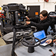 Student working on motor in marine repair lab