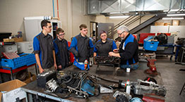 Automotive students listening to instructor in the shop