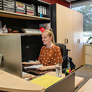 An administrative coordinator in a modern office environment