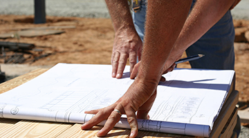 Workers looking at a blueprint