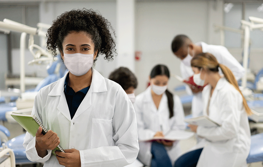 Female student at school and wearing a facemask