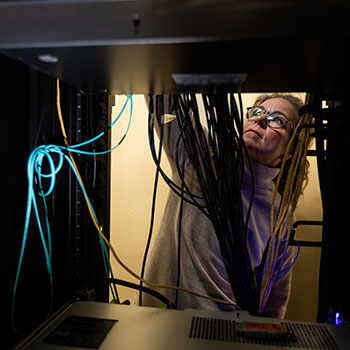 Female IT students doing hands-on work in the classroom