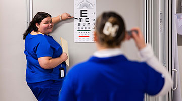 Medical assistant student practicing skills