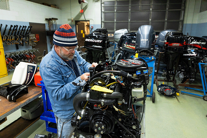 Student working in the marine repair lab