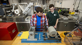Students using equipment in WITC's automated packaging lab