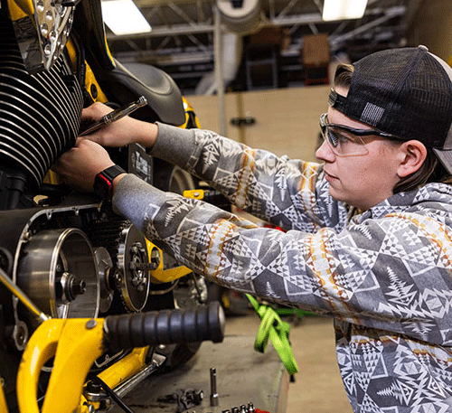 Power Sports student working on motorcylce