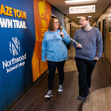 Students walking down a Northwood Tech hallway