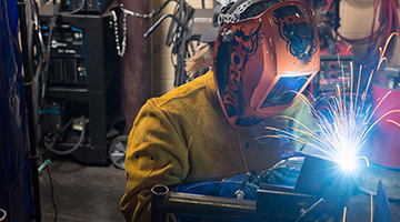A student practicing welding skills