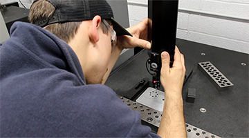 A student doing precision machinery work