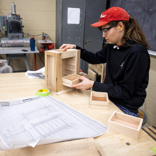 Student completing woodworking project