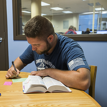 Student working in a study room in the Learning Resource Center